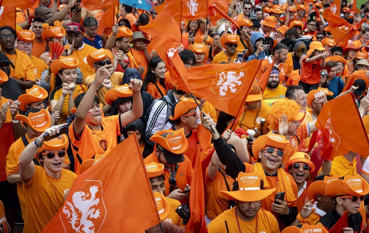 A sea of orange takes over the streets of Arlington before the the FIFA World Cup match between the Netherlands and Japan on Sunday, June 14, 2026 in Arlington, Texas.
